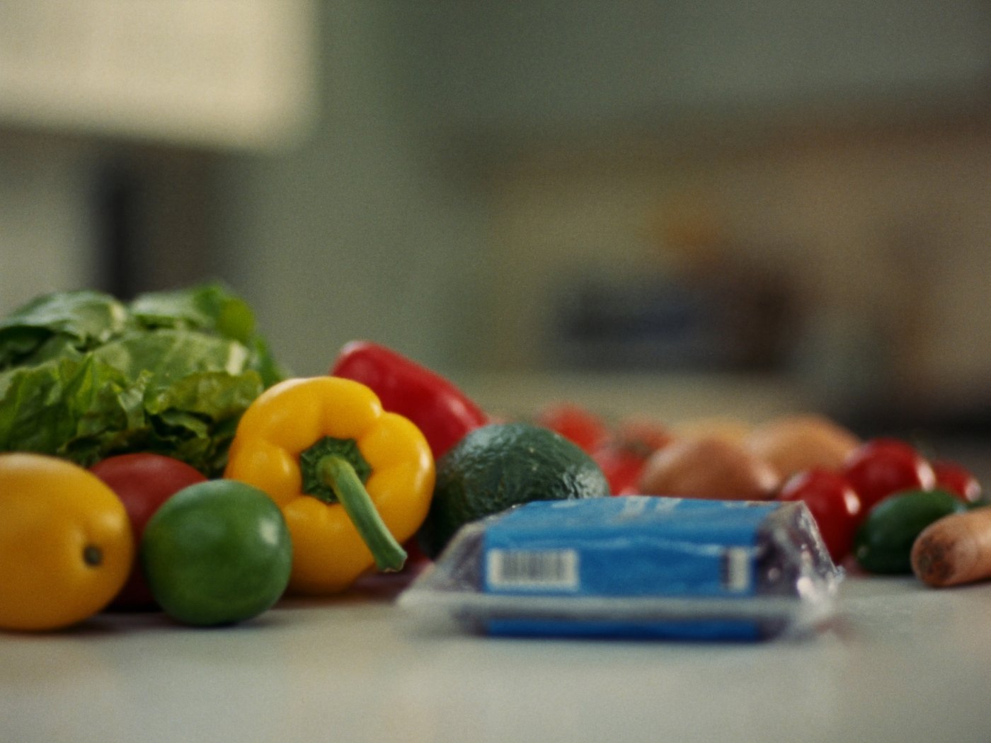 A kitchen counter arranged with fresh wholesome groceries