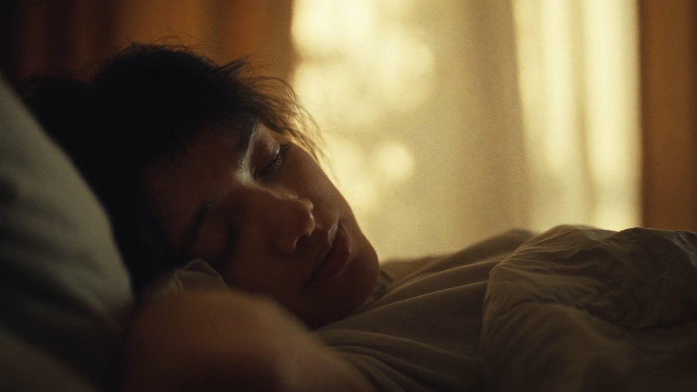 Person waking gently in soft morning light